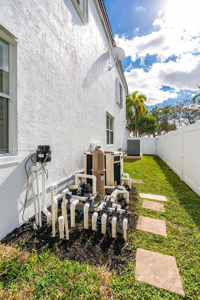 view of yard with central AC