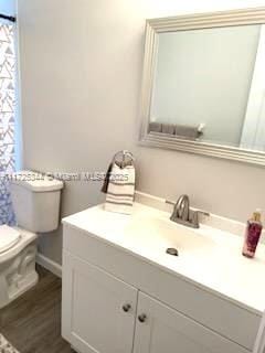 bathroom with vanity and toilet