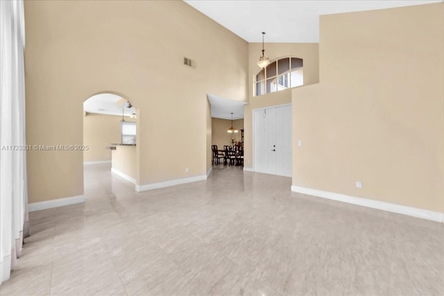 spare room featuring a high ceiling