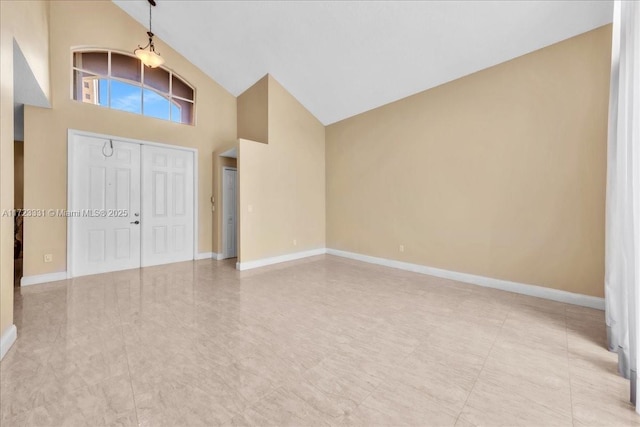 entryway with high vaulted ceiling