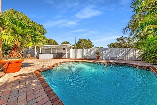 view of swimming pool with a patio