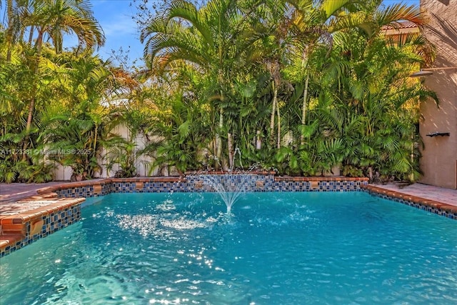 view of pool featuring pool water feature