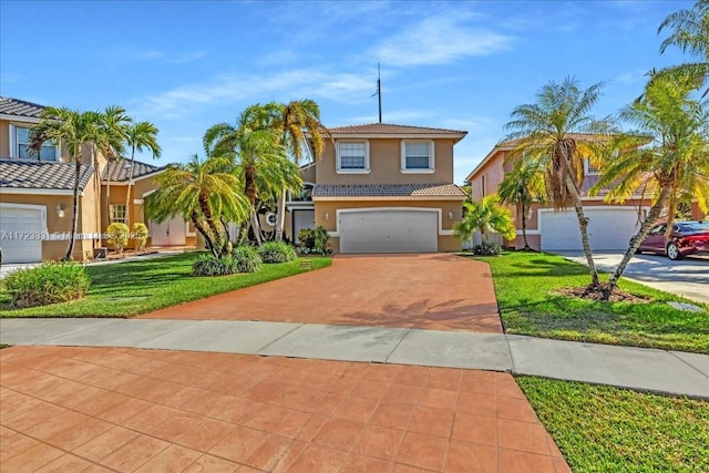 view of front of house with a front lawn and a garage