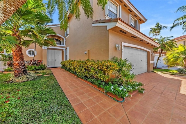 mediterranean / spanish-style home featuring a garage