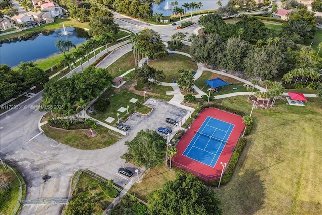 birds eye view of property with a water view