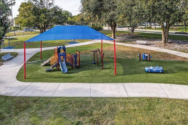 view of playground with a yard