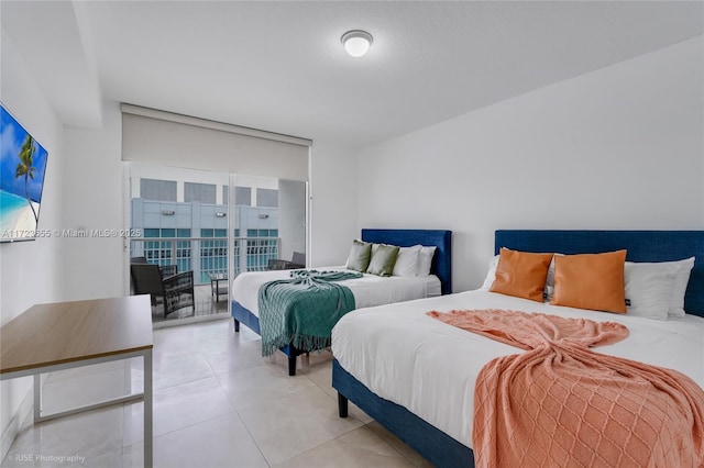 tiled bedroom featuring access to outside and multiple windows