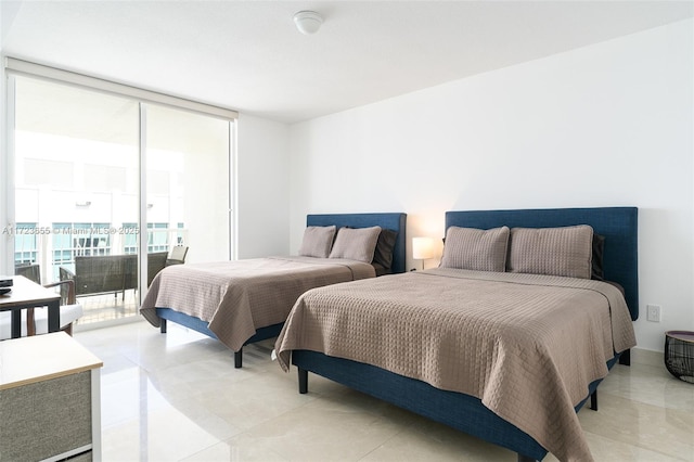 bedroom featuring access to outside, light tile patterned flooring, and expansive windows