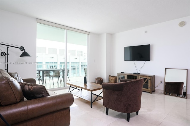 tiled living room featuring expansive windows