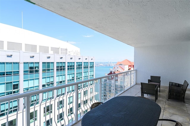 balcony featuring a water view