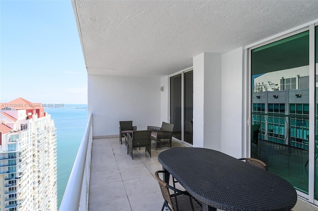 balcony featuring a water view