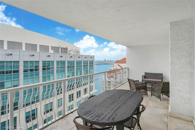 balcony featuring a water view