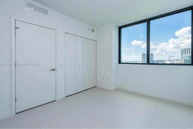 unfurnished bedroom featuring light tile patterned floors