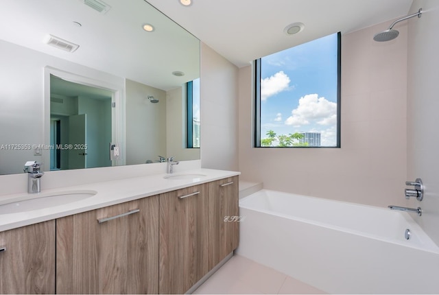 bathroom with shower with separate bathtub, tile patterned floors, and vanity