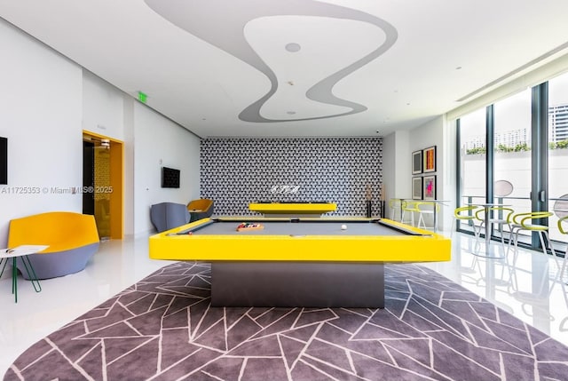 playroom with floor to ceiling windows and pool table