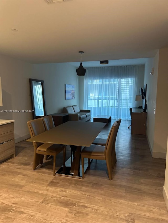 dining room featuring light wood-type flooring