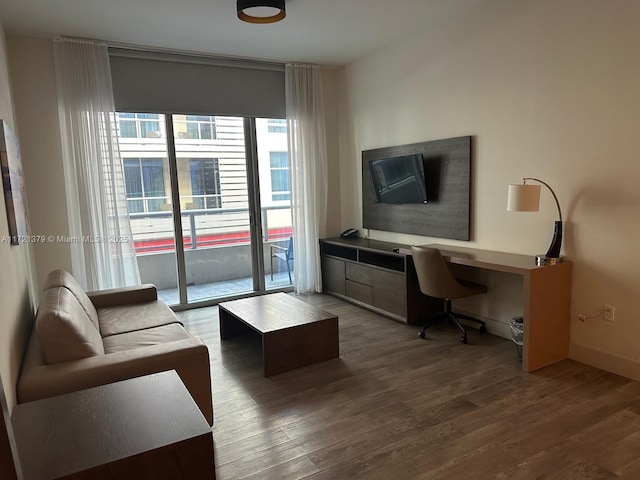 office space with hardwood / wood-style flooring and built in desk