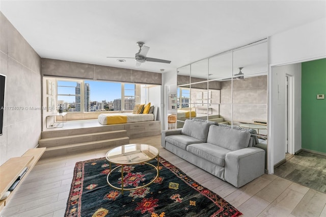 3 Island Ave Pha, Pha, Miami Beach, FL 33139 - living area with wood finished floors, a view of city, a ceiling fan, and tile walls