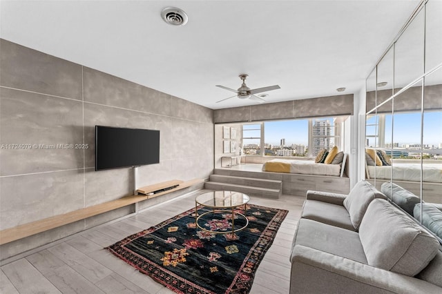 3 Island Ave Pha, Pha, Miami Beach, FL 33139 - living area with wood finished floors, ceiling fan, and visible vents