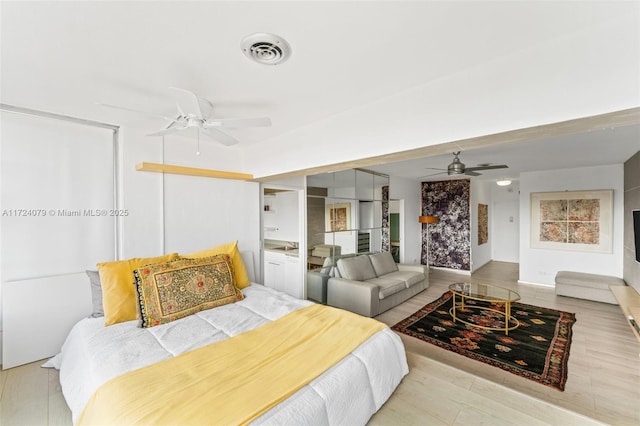 3 Island Ave Pha, Pha, Miami Beach, FL 33139 - bedroom with visible vents, ceiling fan, and wood finished floors