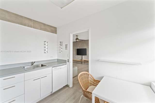 3 Island Ave Pha, Pha, Miami Beach, FL 33139 - kitchen featuring a sink, light wood-type flooring, white cabinetry, and dishwasher