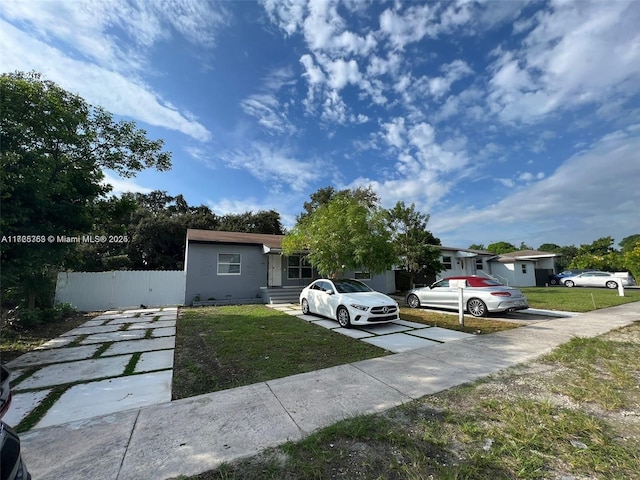 view of front of home with a front lawn