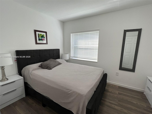 bedroom featuring dark hardwood / wood-style floors