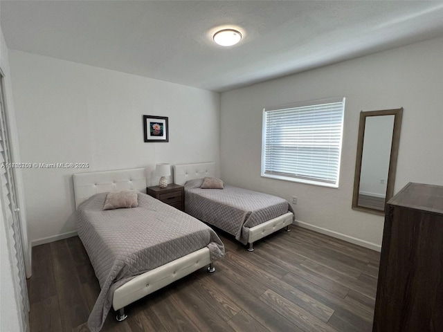 bedroom featuring dark hardwood / wood-style flooring