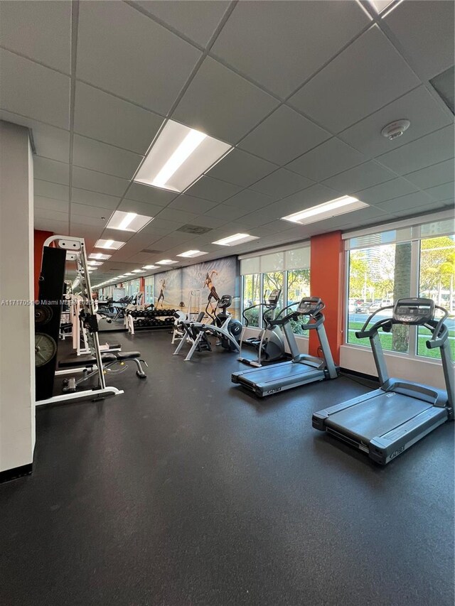 exercise room featuring a drop ceiling