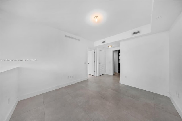 bathroom with tile patterned flooring and toilet