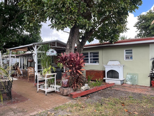 back of house with a patio area, a gazebo, and a jacuzzi