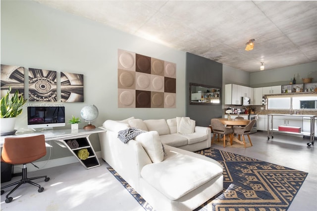 living room featuring concrete flooring