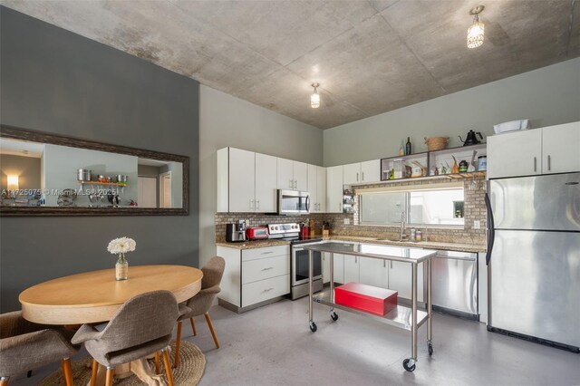 living room featuring concrete flooring and sink