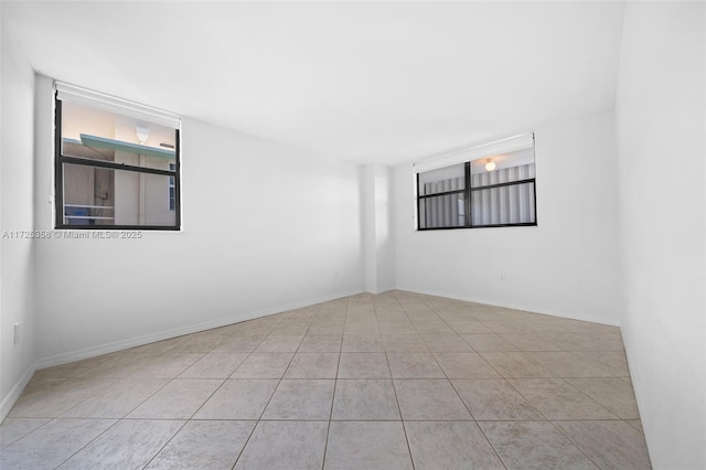 spare room featuring light tile patterned floors