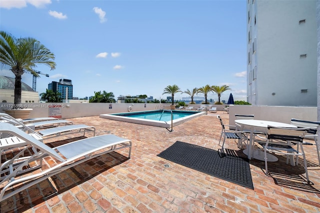 view of swimming pool with a patio