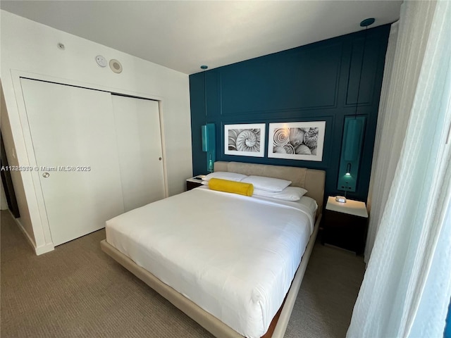 carpeted bedroom featuring a closet