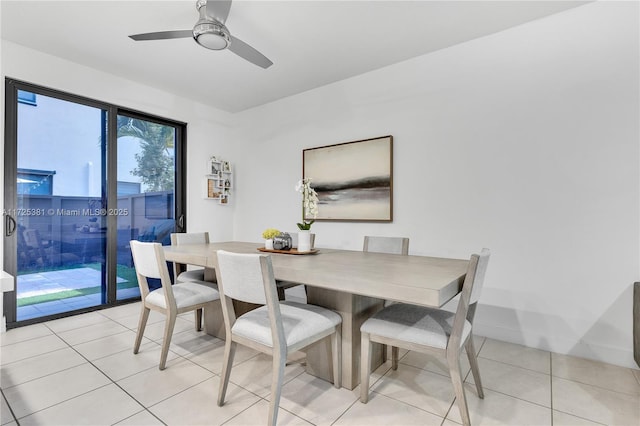 dining room with ceiling fan and light tile patterned flooring