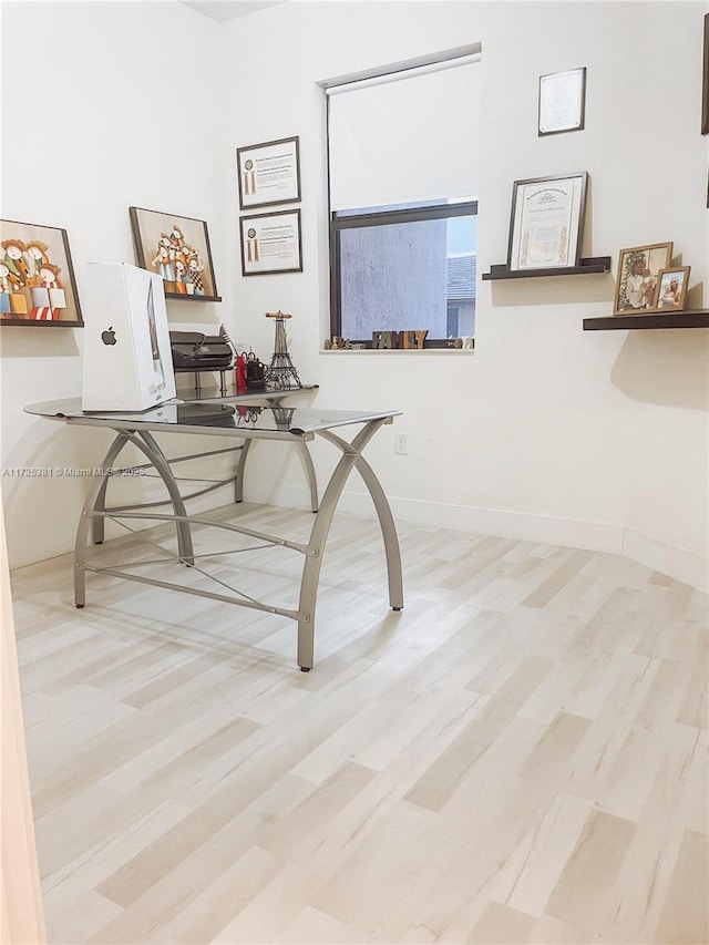 office area with light wood-type flooring