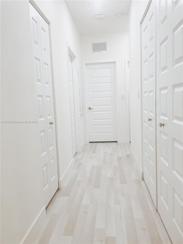 hall featuring light wood-type flooring