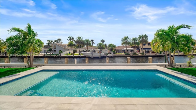 view of swimming pool with a water view