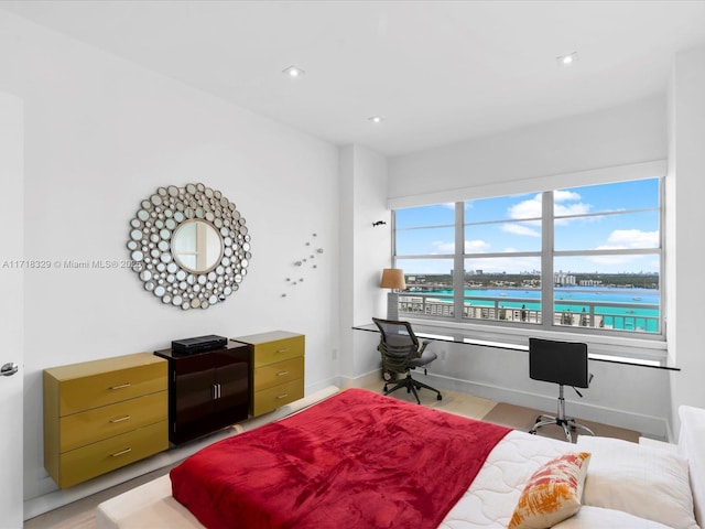 bedroom featuring a water view