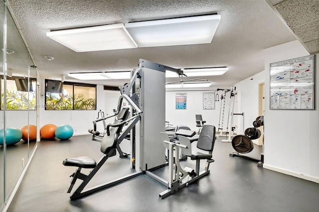 gym with a textured ceiling