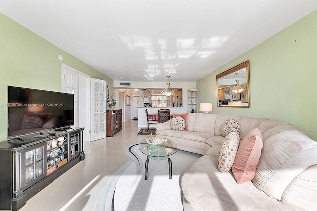 living room featuring a chandelier