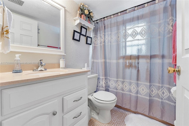 bathroom featuring toilet, tile patterned flooring, curtained shower, and vanity