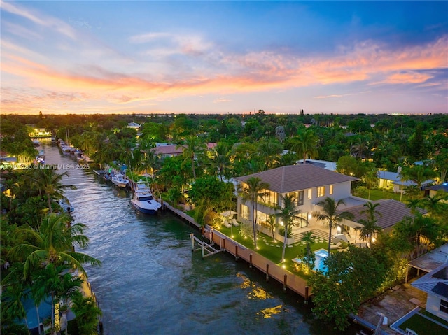 aerial view at dusk with a water view