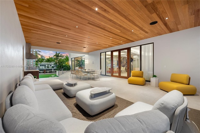 living room featuring french doors and wooden ceiling