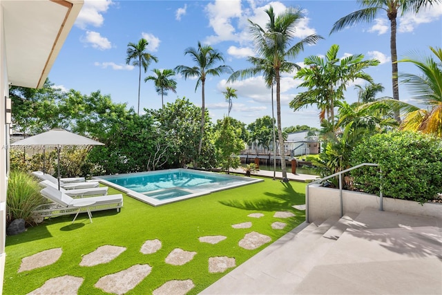 view of swimming pool with a patio and a lawn