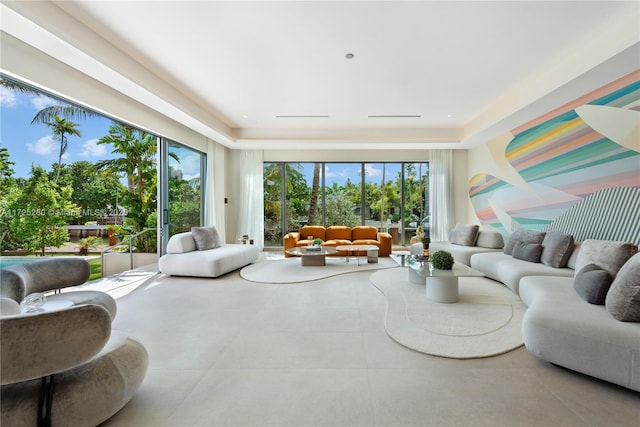 sunroom / solarium with a raised ceiling