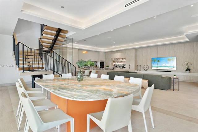 dining room featuring a tray ceiling