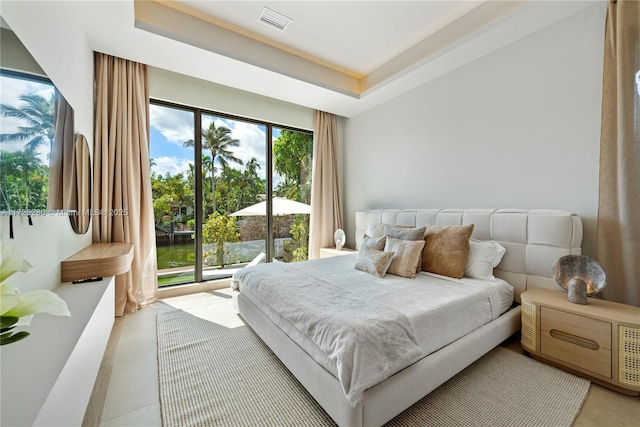 bedroom with a tray ceiling